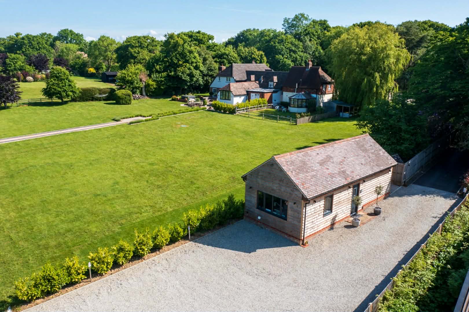 Aerial view of the Nurture Body Therapy treatment room and surrounding grounds in Ashford, Kent